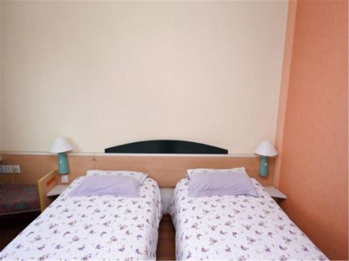 Motel Qingdao Jiaonan Renmin Road Business Street Bagian luar foto